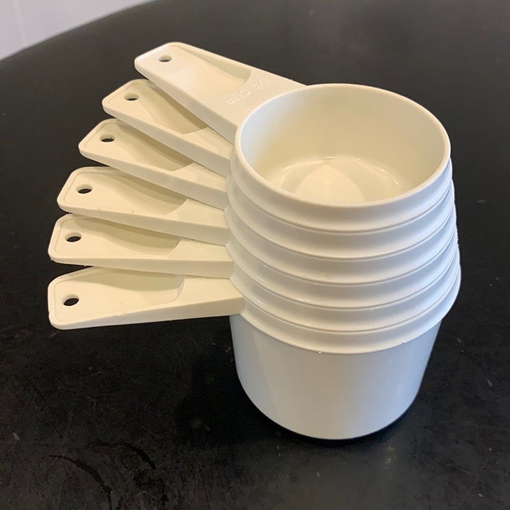Tupperware measuring cups. White. EUC